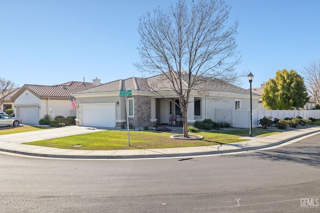 view of front of house with a garage and a front lawn