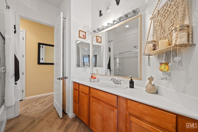 bathroom with hardwood / wood-style flooring and vanity