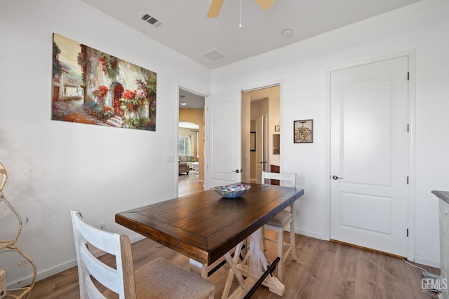 dining room featuring ceiling fan and hardwood / wood-style floors