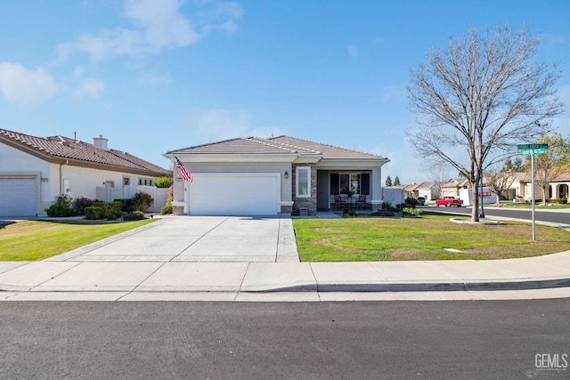 view of front of home featuring a front yard and a garage