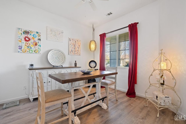 dining room featuring ceiling fan and hardwood / wood-style floors