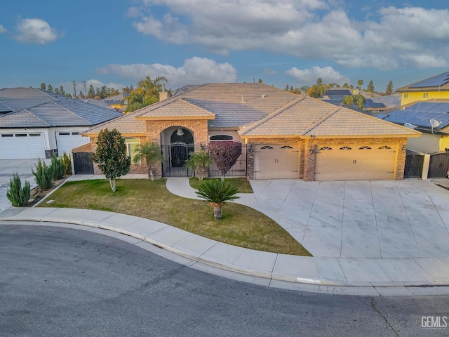 single story home featuring a garage and a front yard