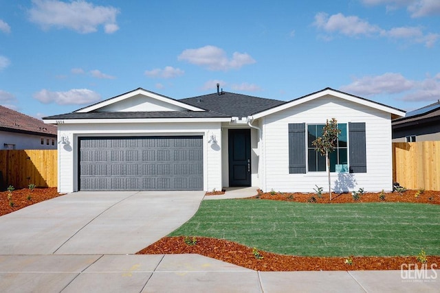 ranch-style house with a garage and a front lawn