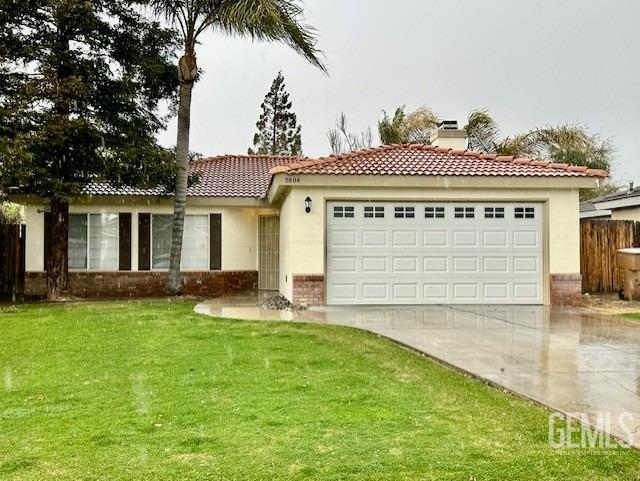 view of front of property with stucco siding, driveway, a front lawn, a garage, and a chimney