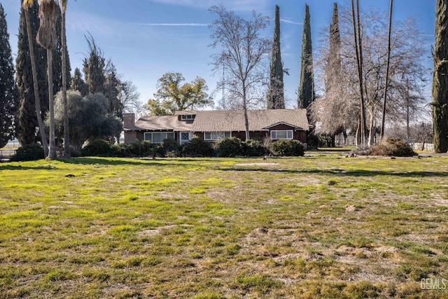 view of front of home with a front yard