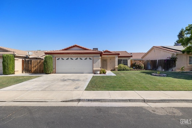 5414 Tyner Ln, Bakersfield, CA 93307 - view of front of house featuring a tiled roof, an attached garage, stucco siding, and driveway