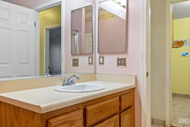 5414 Tyner Ln, Bakersfield, CA 93307 - bathroom with vanity, baseboards, and tile patterned flooring