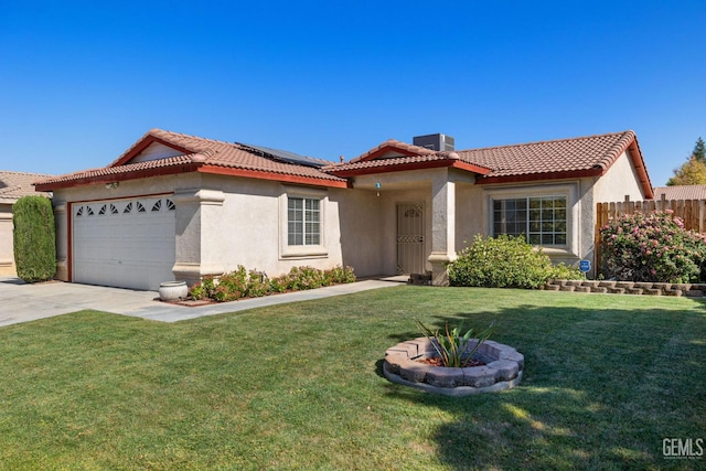 5414 Tyner Ln, Bakersfield, CA 93307 - view of front of home with stucco siding, a tile roof, roof mounted solar panels, and an attached garage