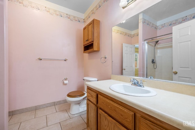 5414 Tyner Ln, Bakersfield, CA 93307 - bathroom with toilet, a stall shower, vanity, baseboards, and tile patterned flooring