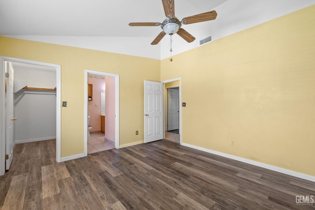 5414 Tyner Ln, Bakersfield, CA 93307 - unfurnished bedroom with wood finished floors, a spacious closet, baseboards, a closet, and ensuite bath