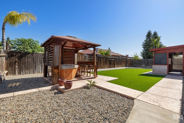5414 Tyner Ln, Bakersfield, CA 93307 - view of yard with a hot tub, a gazebo, and a patio area