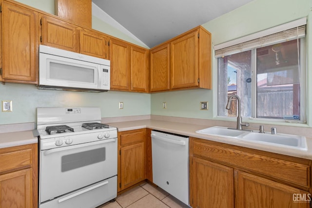 5414 Tyner Ln, Bakersfield, CA 93307 - kitchen featuring white appliances, a sink, lofted ceiling, light countertops, and light tile patterned floors
