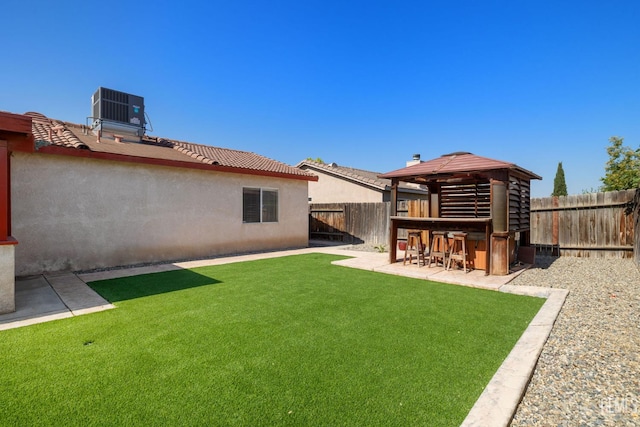 5414 Tyner Ln, Bakersfield, CA 93307 - view of yard with central AC unit, a gazebo, and a patio
