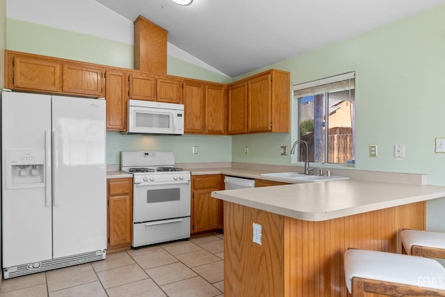 5414 Tyner Ln, Bakersfield, CA 93307 - kitchen with white appliances, a sink, vaulted ceiling, a peninsula, and light countertops