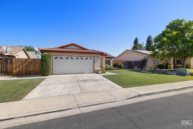 5414 Tyner Ln, Bakersfield, CA 93307 - single story home featuring a tile roof, solar panels, concrete driveway, a garage, and stucco siding
