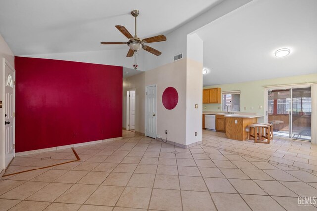 5414 Tyner Ln, Bakersfield, CA 93307 - unfurnished living room featuring a ceiling fan, light tile patterned floors, a sink, baseboards, and high vaulted ceiling