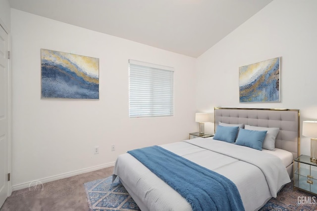 carpeted bedroom with lofted ceiling