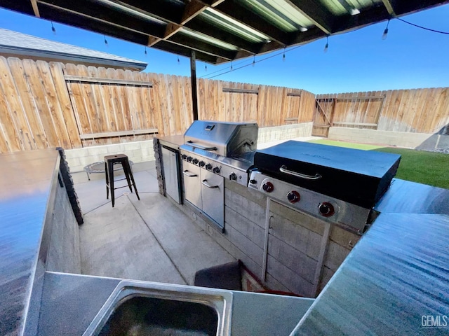 320 E Woodrow St, Taft, CA 93268 - fenced backyard with exterior kitchen