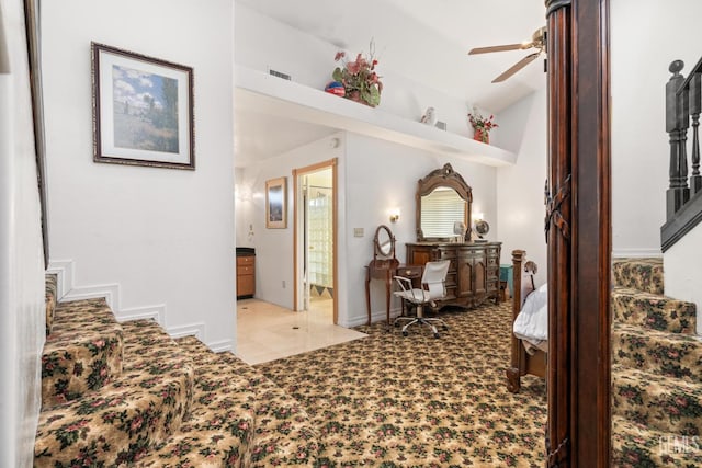 interior space with light colored carpet and ensuite bath