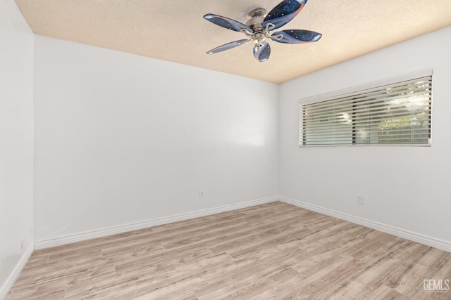 unfurnished room with a textured ceiling, ceiling fan, and light hardwood / wood-style flooring