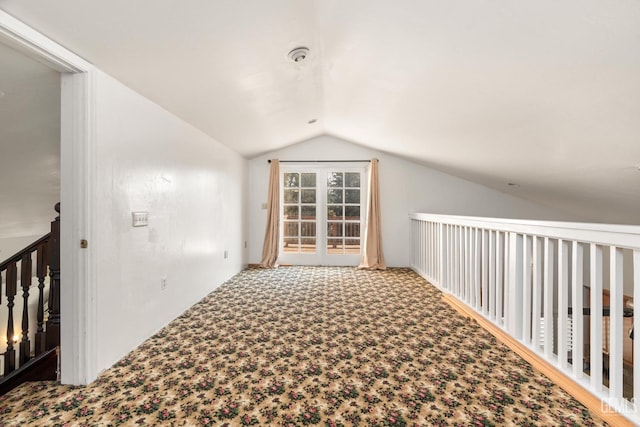 bonus room featuring carpet floors and vaulted ceiling