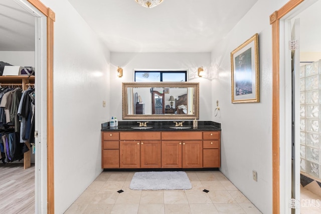 bathroom with tile patterned floors and vanity