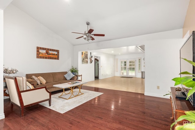 living room featuring lofted ceiling, dark hardwood / wood-style floors, ceiling fan, and french doors