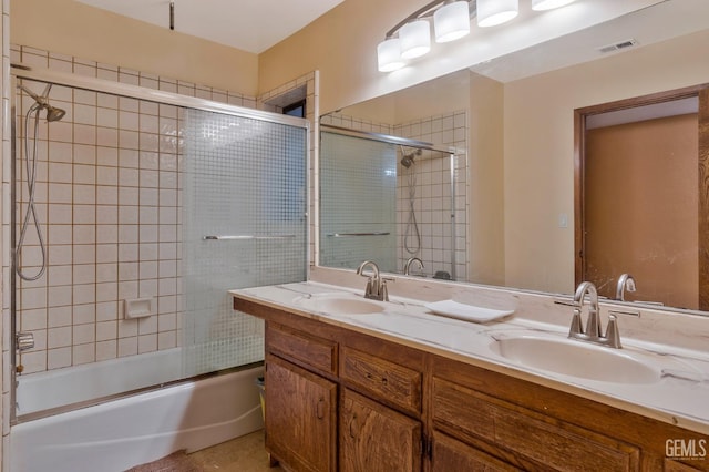 bathroom with enclosed tub / shower combo and vanity