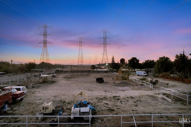 view of yard at dusk