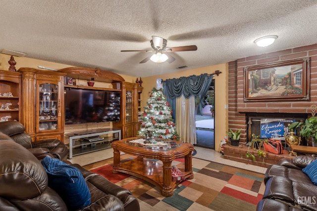 living room with ceiling fan and a textured ceiling