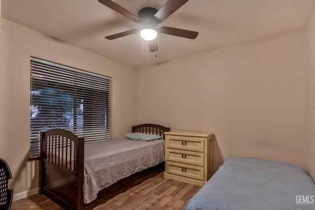 bedroom with ceiling fan and hardwood / wood-style floors