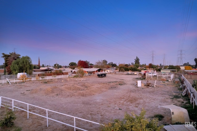 view of yard at dusk