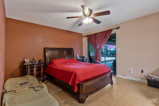 bedroom featuring access to exterior, light tile patterned floors, and ceiling fan