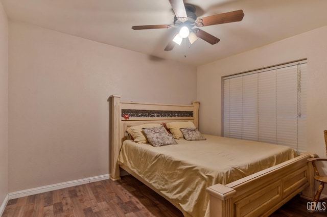 bedroom with ceiling fan and dark hardwood / wood-style floors