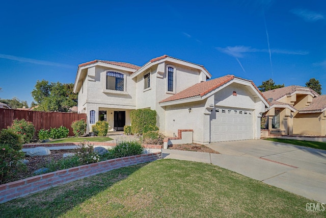 mediterranean / spanish-style home with a front lawn and a garage