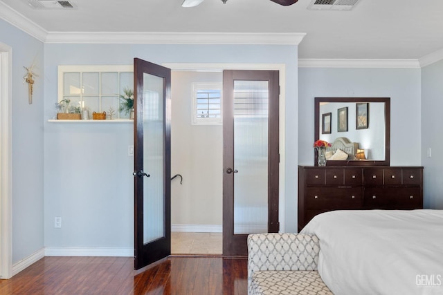 bedroom featuring dark hardwood / wood-style flooring, ceiling fan, french doors, and ornamental molding