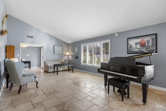 miscellaneous room featuring high vaulted ceiling