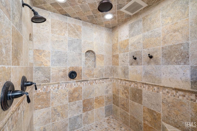 room details with a tile shower