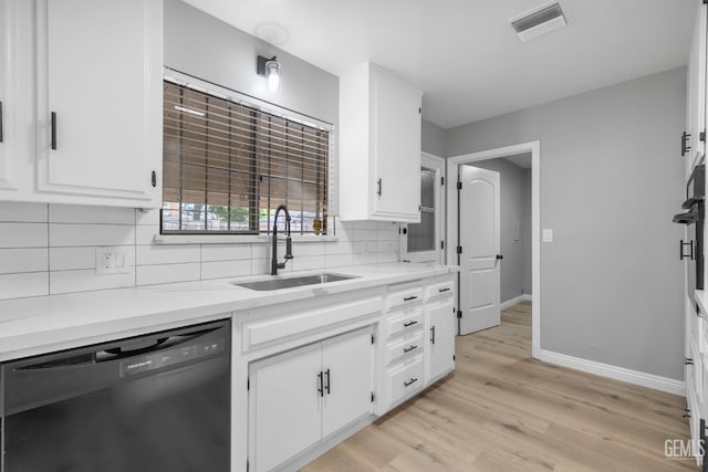 2848 Summit Cir, Bakersfield, CA 93306 - kitchen featuring black dishwasher, a sink, backsplash, and white cabinets