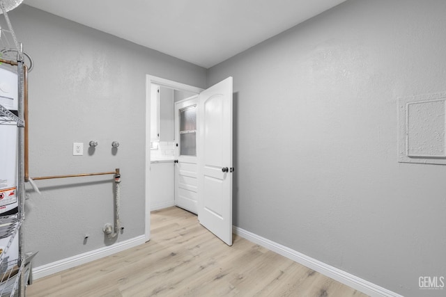 2848 Summit Cir, Bakersfield, CA 93306 - washroom featuring light wood finished floors, gas dryer hookup, and baseboards