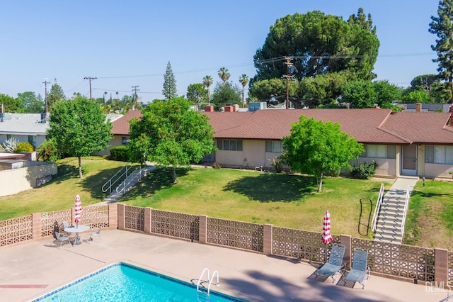 2848 Summit Cir, Bakersfield, CA 93306 - view of swimming pool featuring stairs, a lawn, and a patio