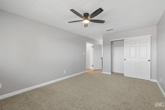 2848 Summit Cir, Bakersfield, CA 93306 - unfurnished bedroom with light carpet, baseboards, a closet, and ceiling fan