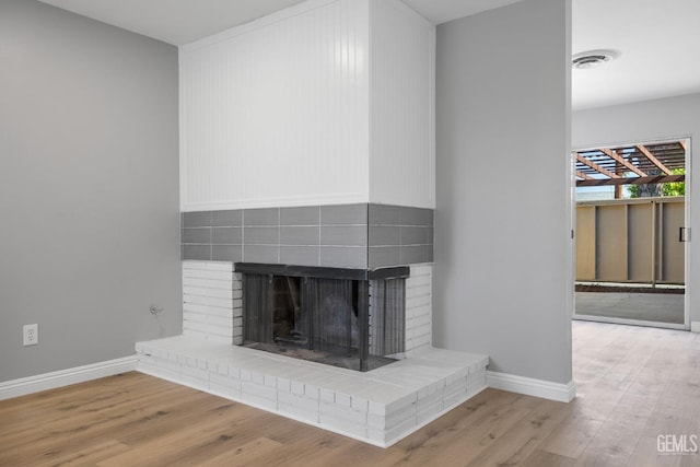 2848 Summit Cir, Bakersfield, CA 93306 - detailed view of wood finished floors, baseboards, and a fireplace