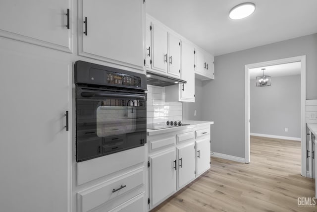 2848 Summit Cir, Bakersfield, CA 93306 - kitchen with black appliances, tasteful backsplash, white cabinets, light wood-style flooring, and light countertops