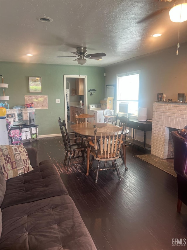 dining area featuring washer / dryer, wood-type flooring, baseboards, and ceiling fan
