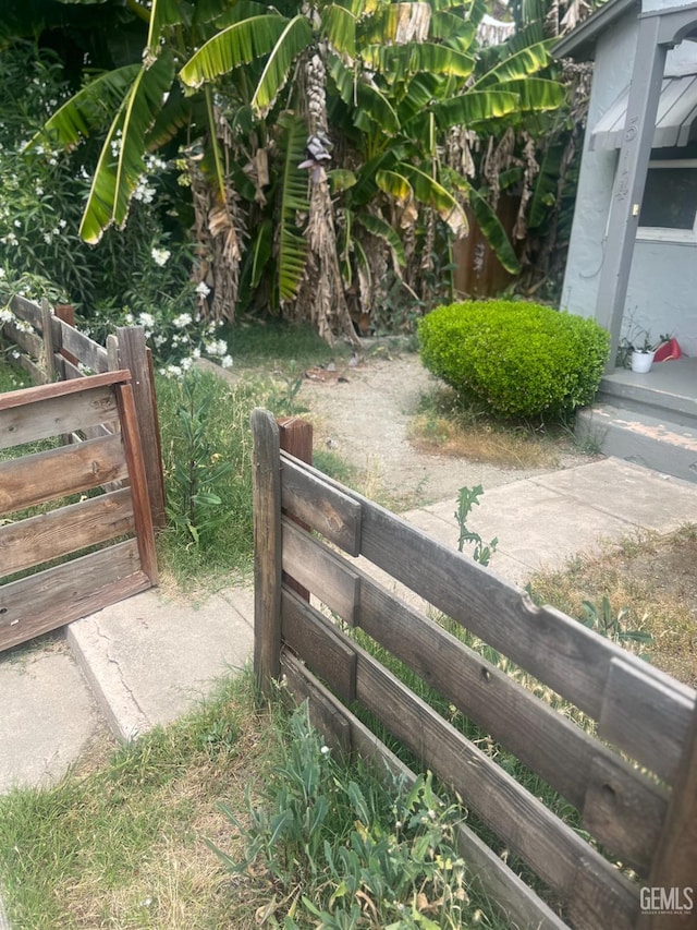 view of gate featuring fence