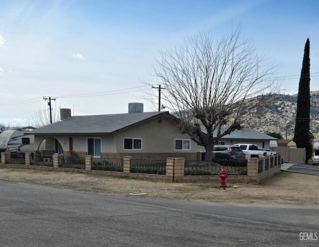 view of front of home featuring a mountain view