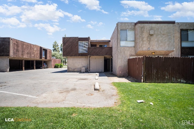 2105 Pinion Springs Cir Unit D, Bakersfield, CA 93309 - back of property featuring uncovered parking and stucco siding