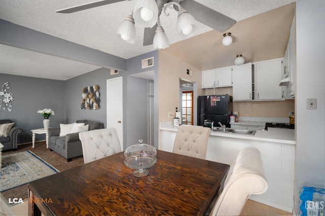 2105 Pinion Springs Cir Unit D, Bakersfield, CA 93309 - dining space featuring a textured ceiling, ceiling fan, and beam ceiling