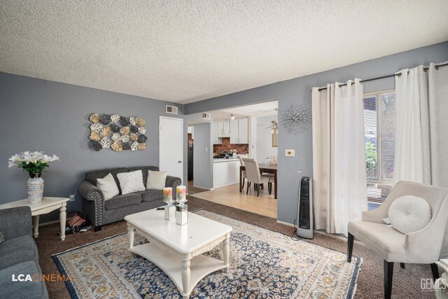 2105 Pinion Springs Cir Unit D, Bakersfield, CA 93309 - living room featuring a textured ceiling